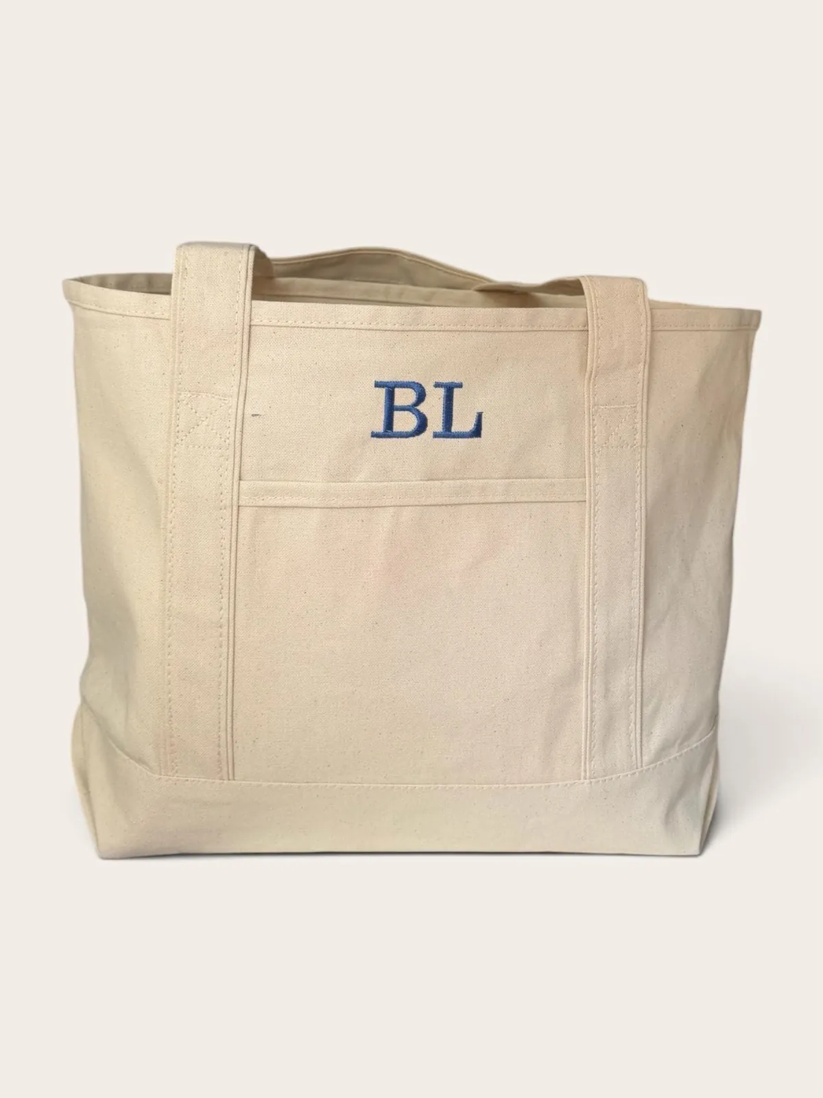 Natural canvas tote with BL embroidered in blue on the front