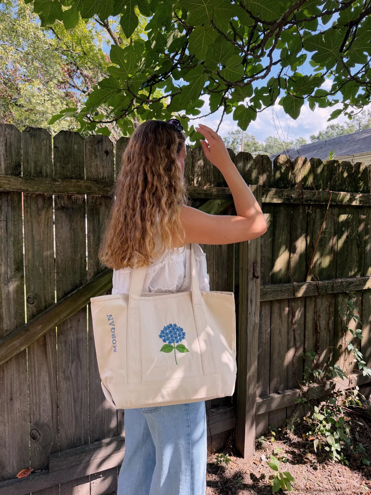Carrying the Hydrangea tote in a leafy backyard